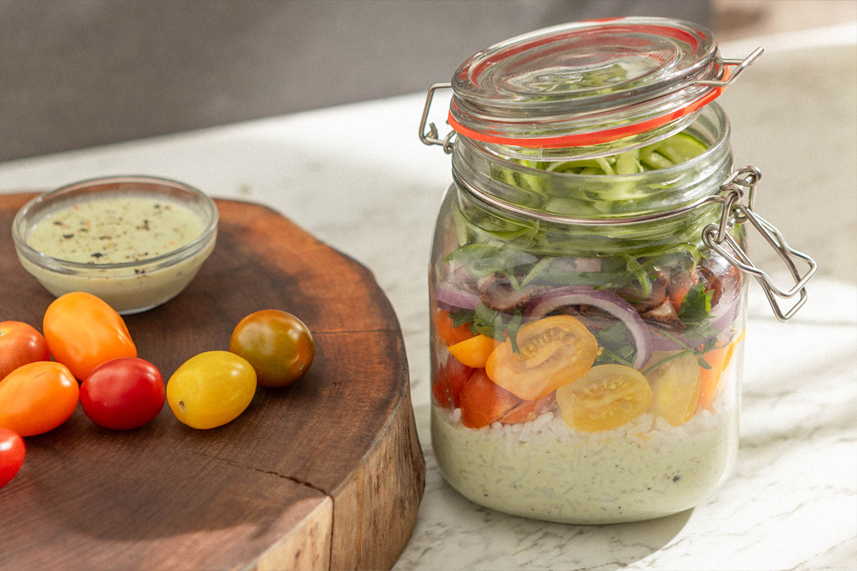 https://www.pure-flavor.com/wp-content/uploads/PF-Rice-and-Cucumber-Mason-Jar-Salad-WP-Hero.jpg